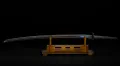 The Mantetsu blade in its Shin Guntō mounting, displayed on a stand
