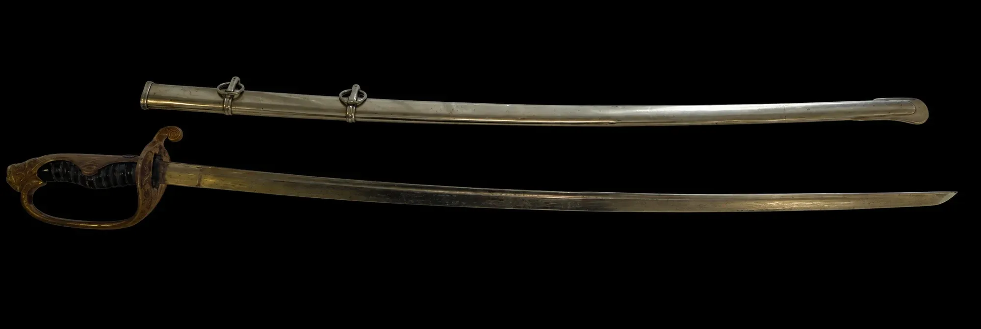 The saber in its bright nickel-plated scabbard beside the drawn blade, showing the full Type 19 kyū-guntō fittings