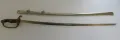 The saber in its bright nickel-plated scabbard beside the drawn blade, showing the full Type 19 kyū-guntō fittings