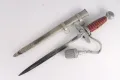 The dagger drawn beside its scabbard, showing the full second-model pattern with the bullion troddel attached