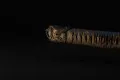 The same-wrapped, leather-corded grip and pommel