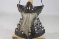 The face armour seen from the front, with its grey hair moustache and the laced throat guard below