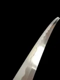 The kissaki, showing the boshi where the hamon runs into the point and turns back