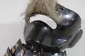 A close view of the chin and mouth of the mask, showing the depth of the lacquer