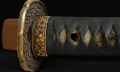The gilt cherry-blossom collar (fuchi)