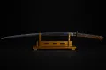 The full length of the mounted sword resting on its stand