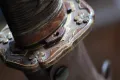 Tsuka detail with brown ito wrap and visible menuki