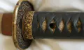 The gilt cherry-blossom collar (fuchi)