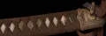 The hilt, showing the cherry-blossom menuki over rayskin, the gilt fuchi and the original leather tassel