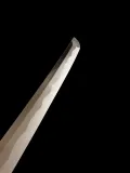 A section of the blade, showing the gunome-midare hamon over the notare