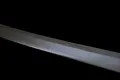 A close view of the blade, showing the sanbonsugi gunome temper line