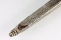 The lower scabbard and chape, showing the oakleaf panel, acorn finial and corrosion through the plating
