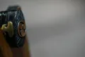 The black kashira carrying a matching triple-comma motif