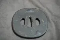The iron tsuba with traces of gold inlay