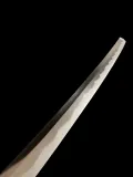 The upper third of the blade towards the point, the gunome-midare hamon climbing along the edge