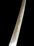 The blade above the habaki, showing the hamon against the shinogi-ji