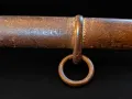 The scabbard mid-section with its single suspension ring and surface corrosion