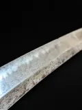 The gunome hamon, clean and well-defined along the blade